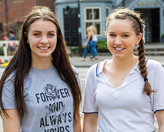 Young women smiling for photograph 