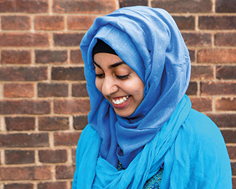 Young woman wearing a blue headscarf