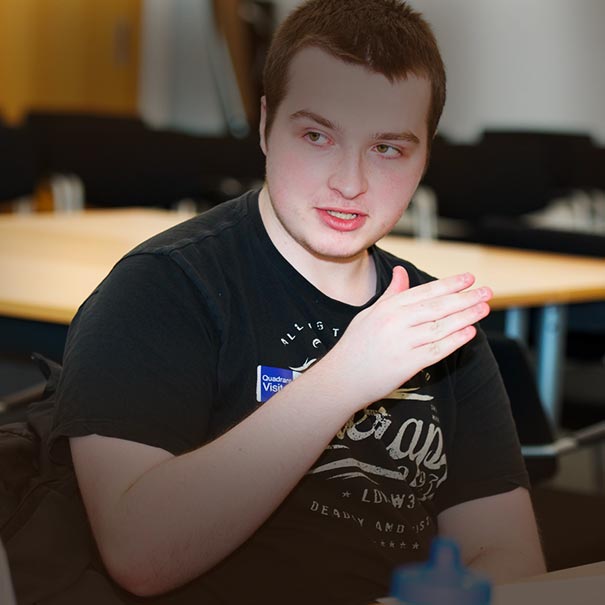 Young man gesturing as he speaks